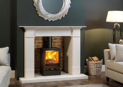 Stovax-Vogue-Midi-woodburning-with-Plinth-and-Claremont-Limestone-Mantel-mi